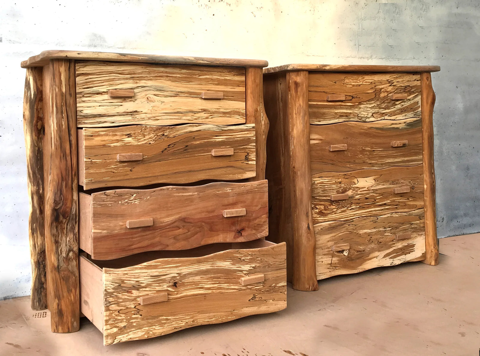Spalted beech four-drawer chest with drawers open showing smooth-running runners, rustic live-edge style