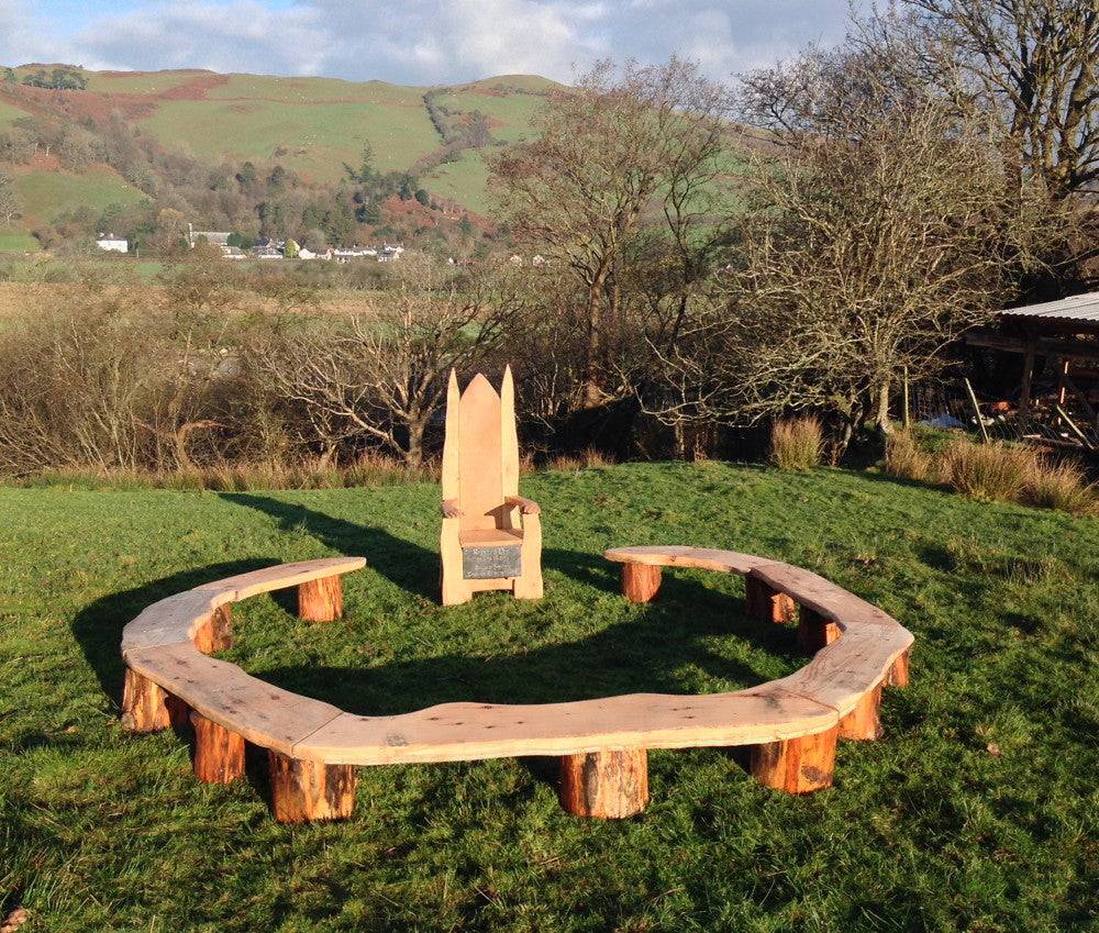 Outdoor circular wooden bench for school — handmade carved oak ring seating, Wales