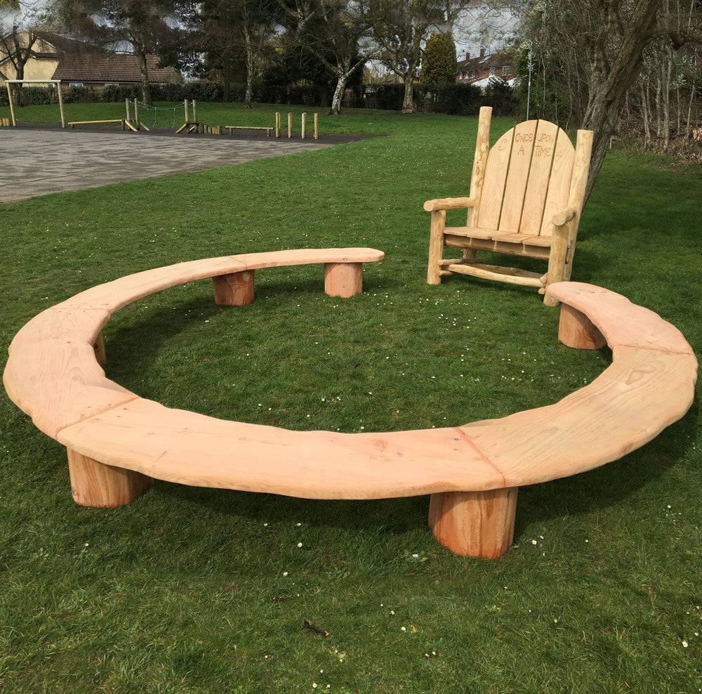 Handmade circular storytelling ring seating — carved oak bench for school playgrounds, Wales