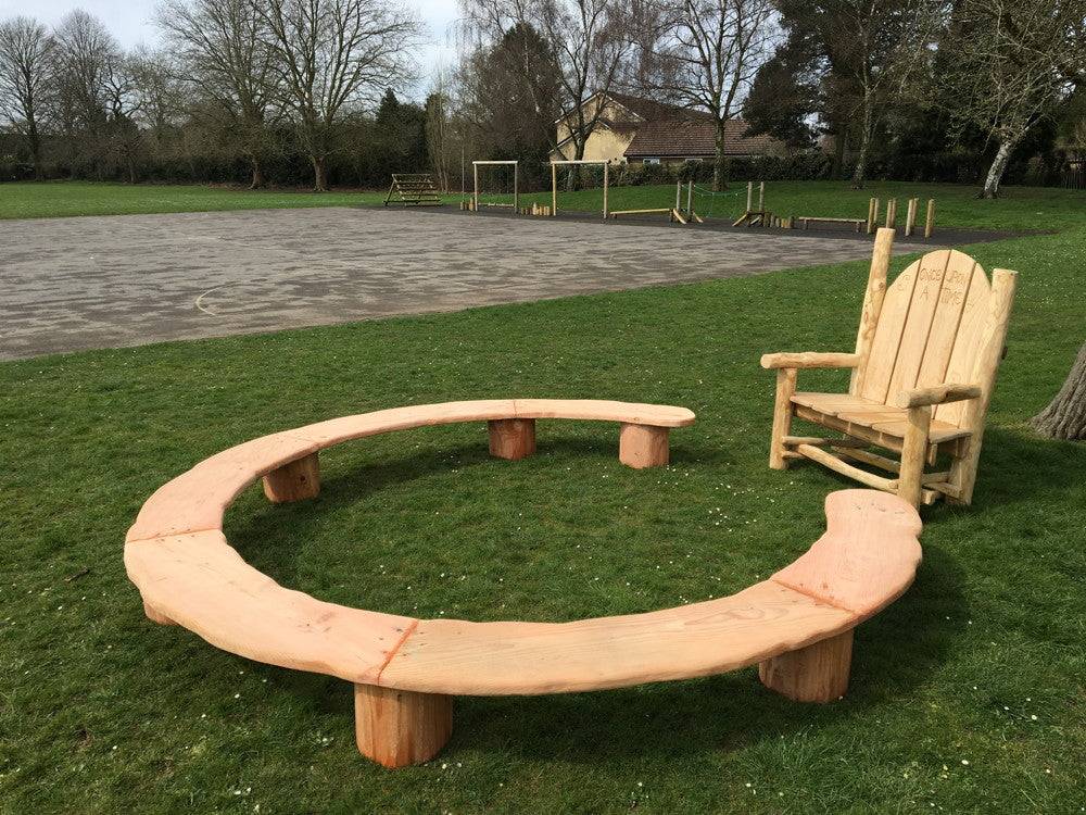 Mushroom-themed circular ring seating — handmade carved oak school bench, Wales