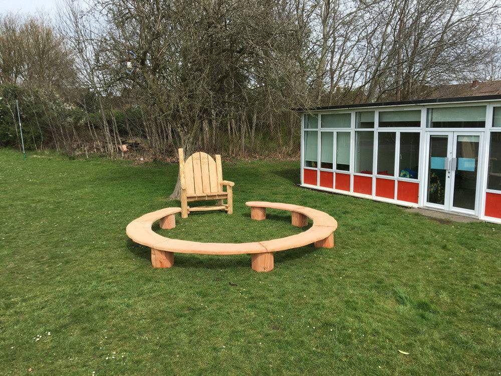Circular school playground seating — handmade wooden bench for outdoor learning spaces, Wales