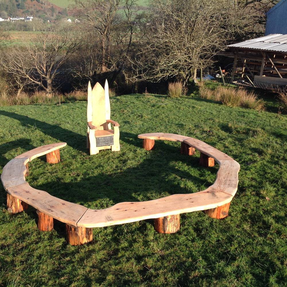 Fairy-themed circular bench — handmade carved oak seating for school playgrounds, Wales