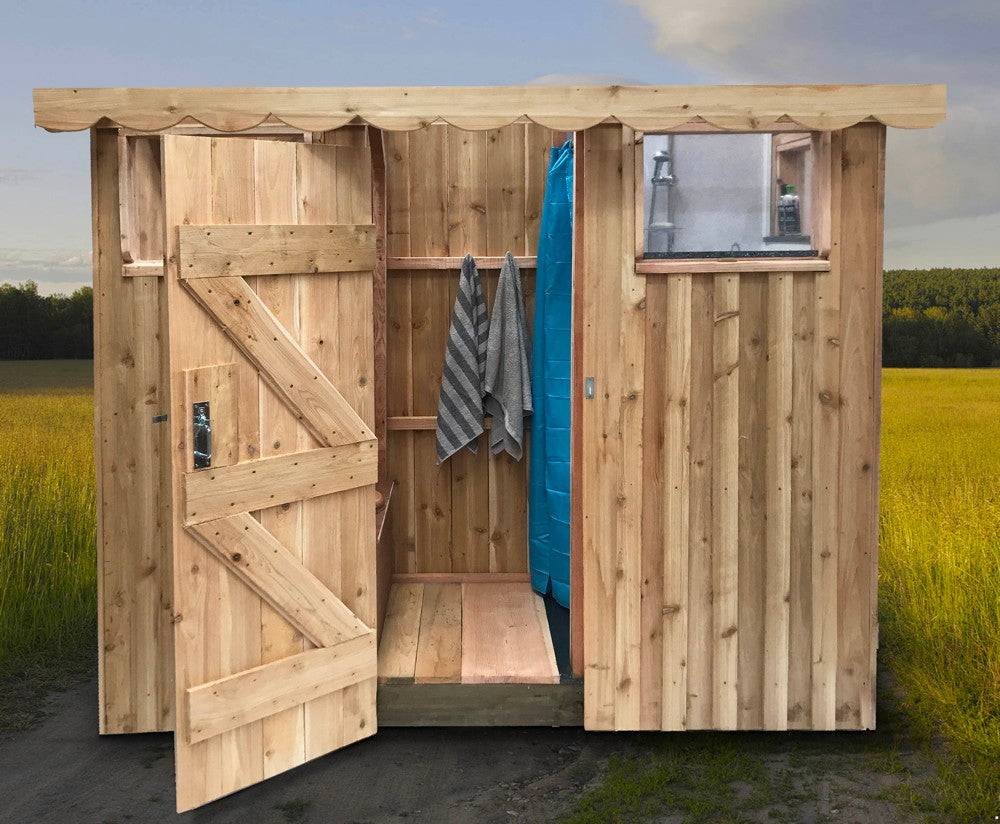 Interior of the Dual Composting Toilet and Shower Unit, featuring a compost toilet, shower, and changing area with sustainable wooden construction.