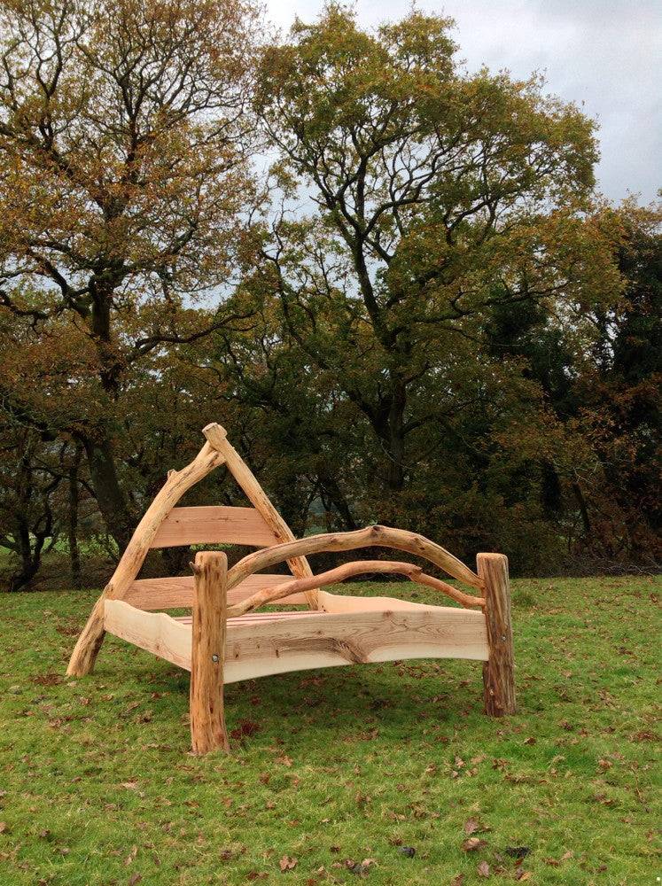 Handmade oak cruck frame bed with A-frame construction — rustic medieval-inspired bed frame, Wales