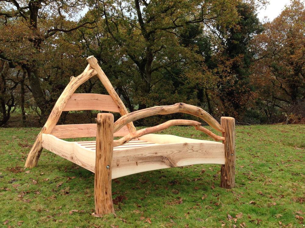 Cruck frame oak wooden bed with natural branch uprights — handmade rustic furniture, Wales