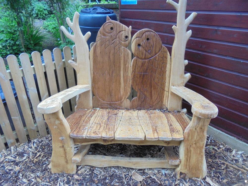 Handcrafted carved oak owl garden bench — bespoke outdoor wildlife furniture, Wales