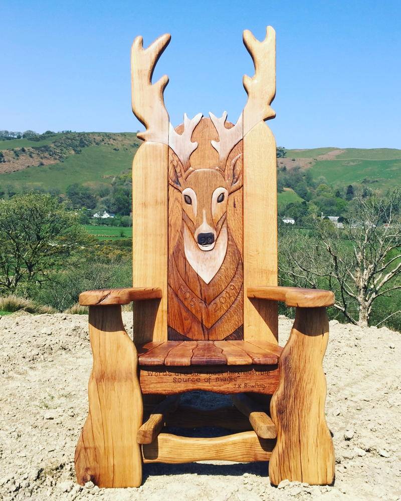 Handcrafted carved oak memorial chair — bespoke personalised tribute seating, Wales