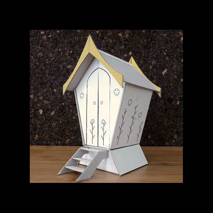Handmade designer composting toilet with slanted roof — stylish eco outdoor facility, Wales