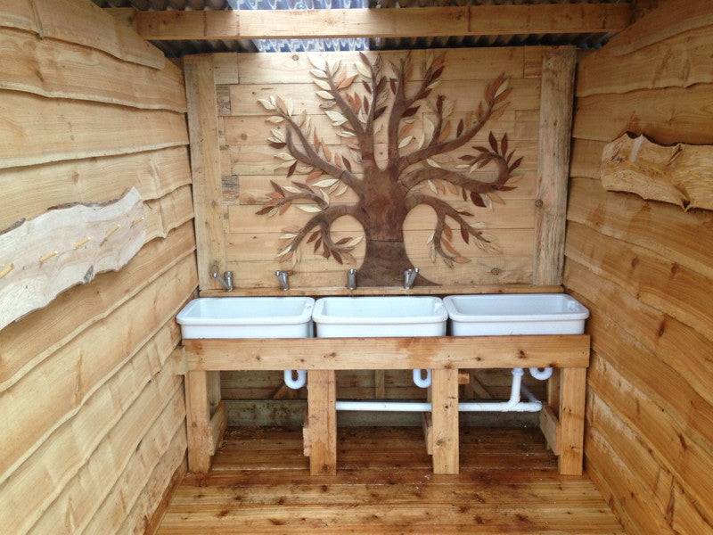 Handwashing sink in accessible compost toilet block — eco-friendly, Wales