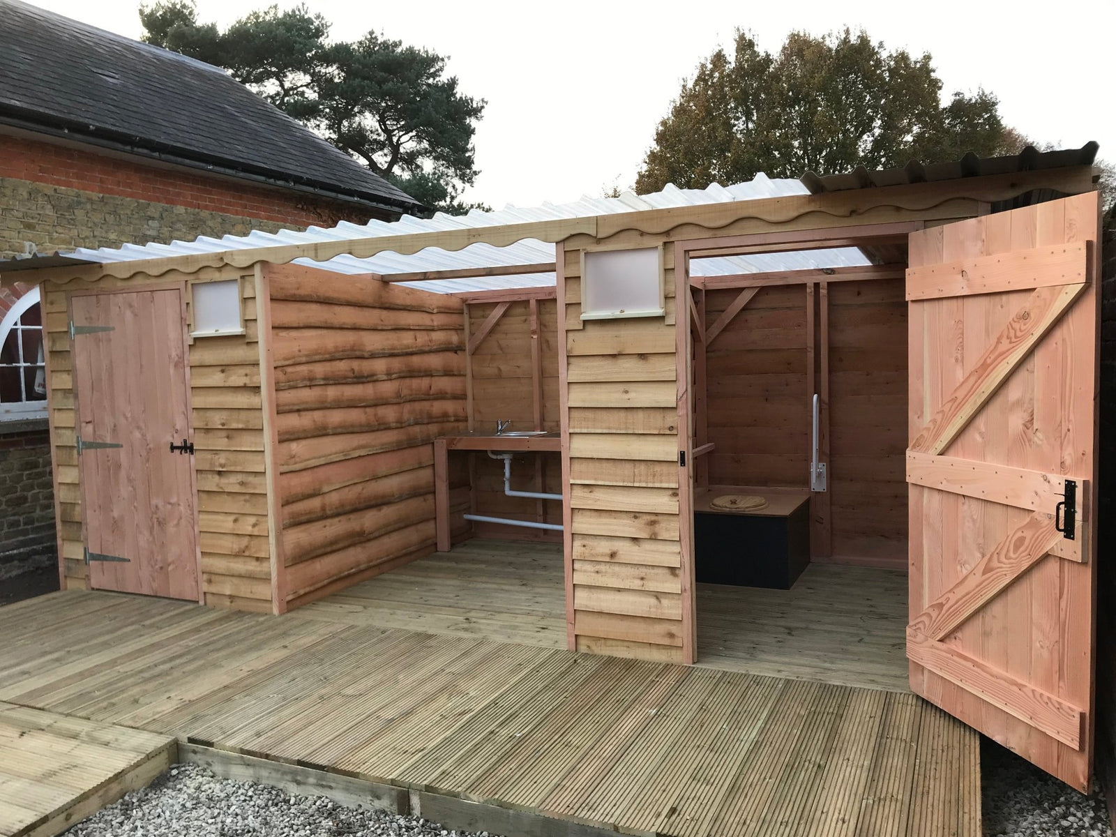 Disabled-access compost toilet with integrated washroom, designed by Free Range Designs for accessibility and sustainability