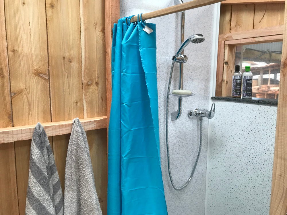 Completed shower and compost toilet built from DIY plans — eco off-grid
