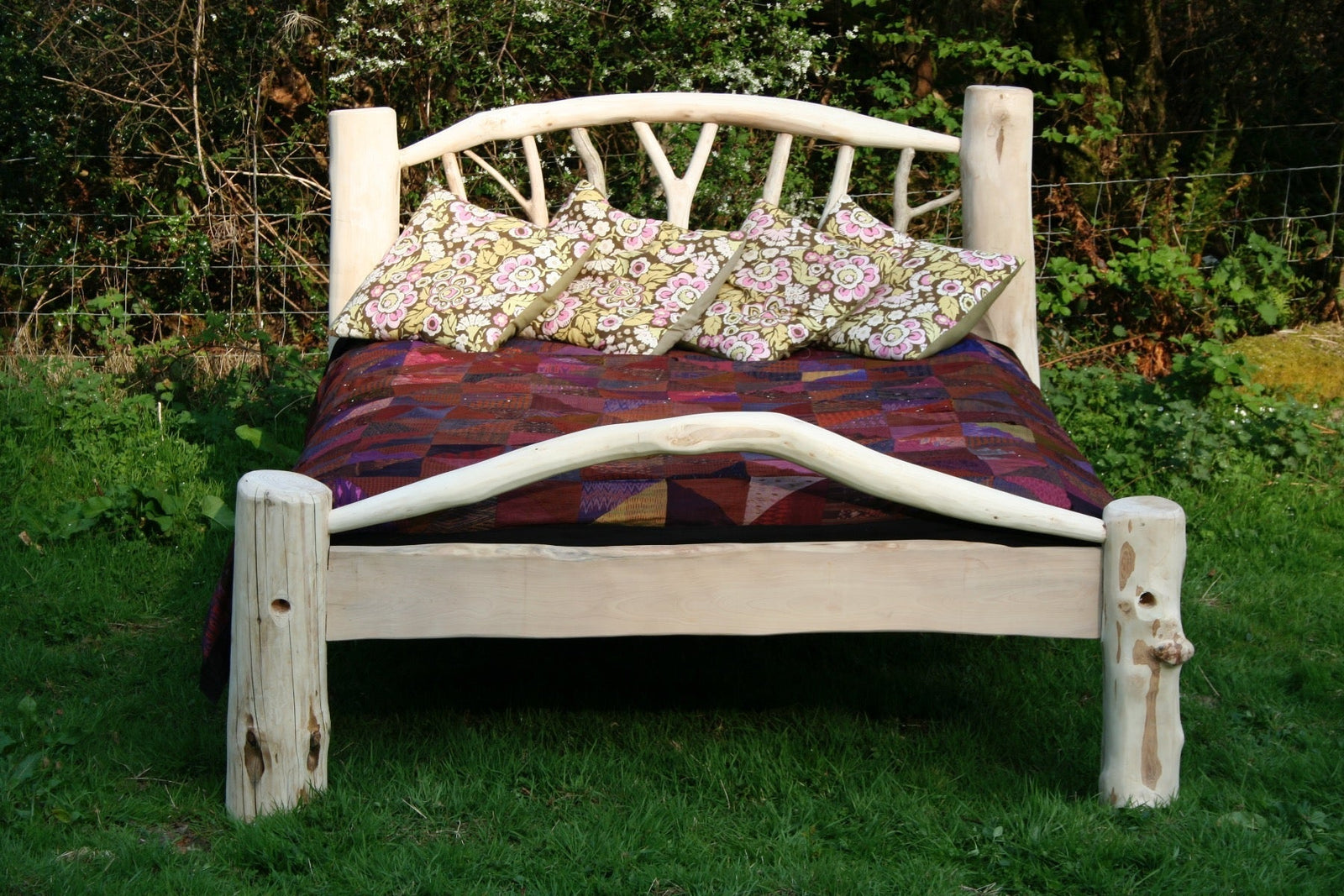 Rustic driftwood bed frame with natural oiled finish — handcrafted bedroom furniture, Wales