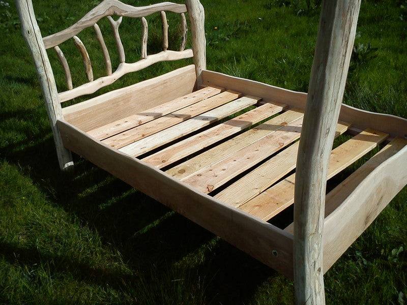 Handmade four poster canopy bed in natural driftwood — rustic bedroom furniture, Wales
