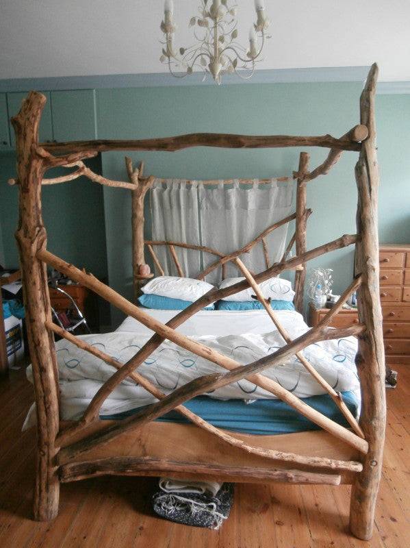 Handmade driftwood four poster bed — solid oak and natural wood bed frame, Wales