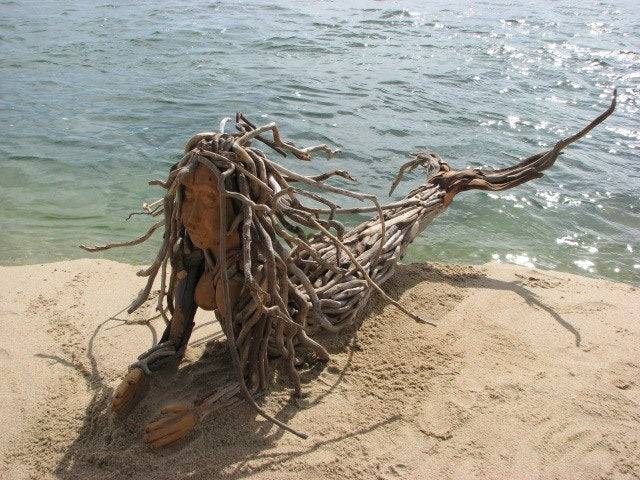 Side view of driftwood mermaid sculpture — natural branch and driftwood wall art, Wales