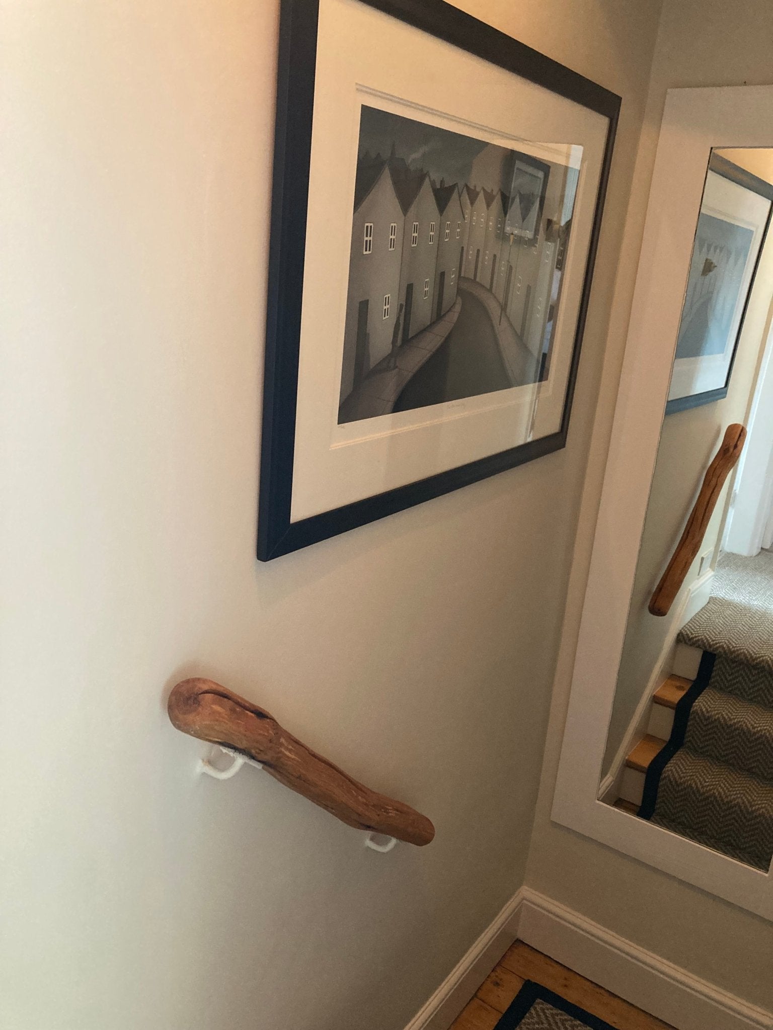 Natural driftwood oak handrail installed on carpeted stairs — handmade bespoke stair bannister, Wales