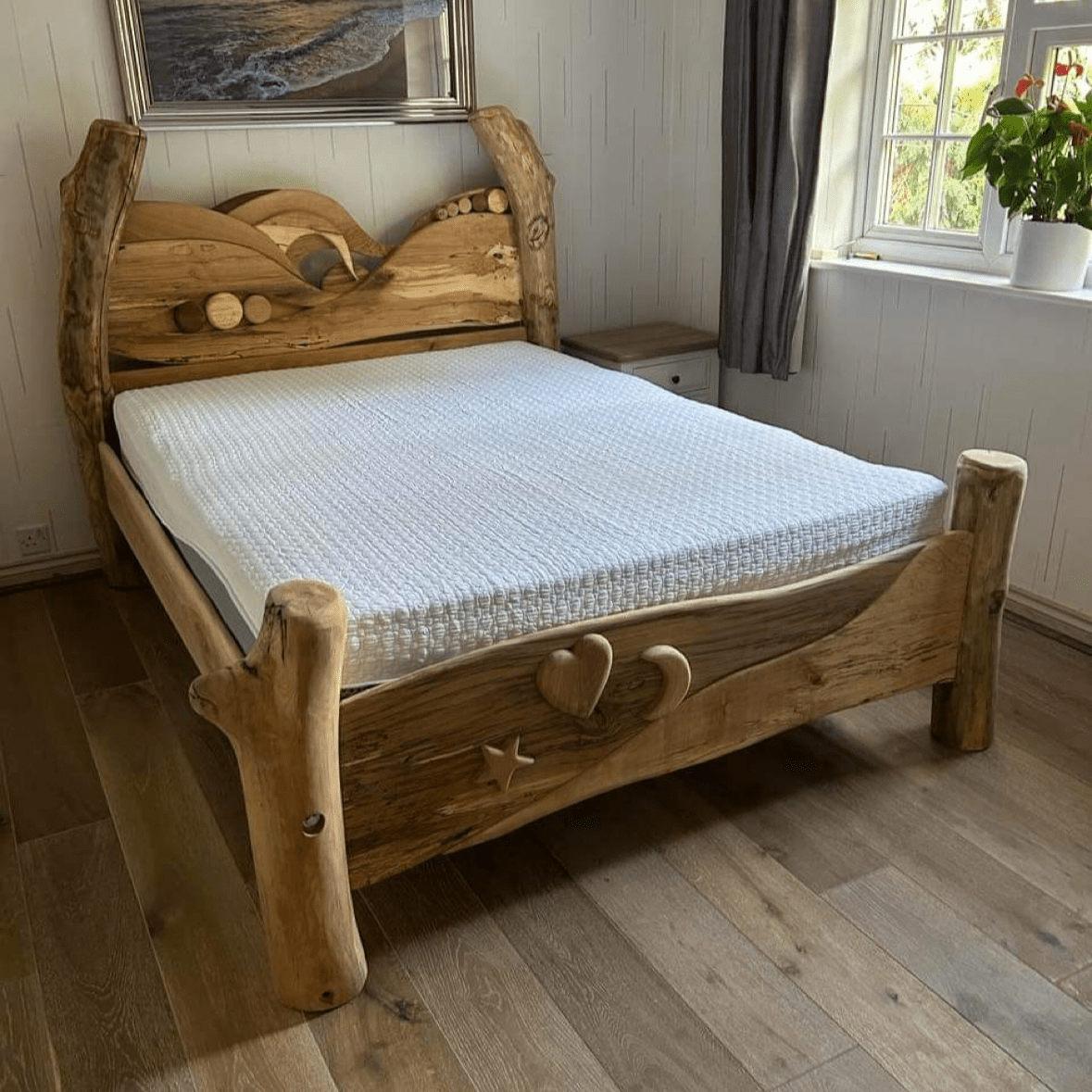 Hand-carved Driftwood Wave Bed Frame with spalted beech backboard and bespoke design, showcasing rustic charm and eco-friendly materials for a natural look.