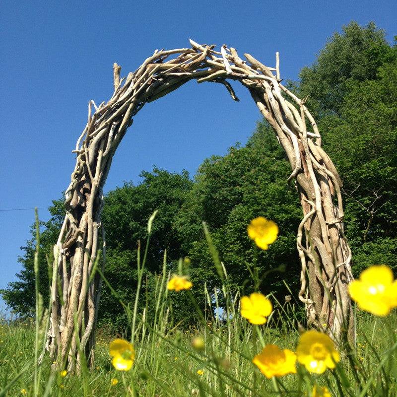 Natural driftwood wedding arch with branch canopy — handmade garden archway, Wales