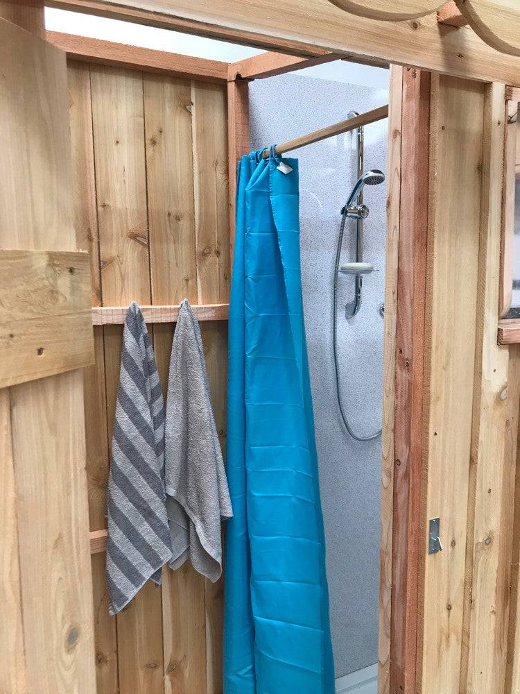 Shower and compost toilet unit exterior — handmade eco outdoor dual facility, Wales
