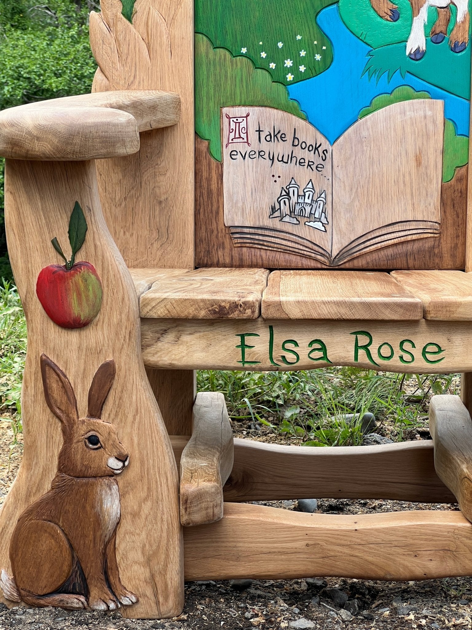 Side carvings of apple, rabbit and tortoise on handmade oak fairytale storytelling chair — bespoke school chair, Wales