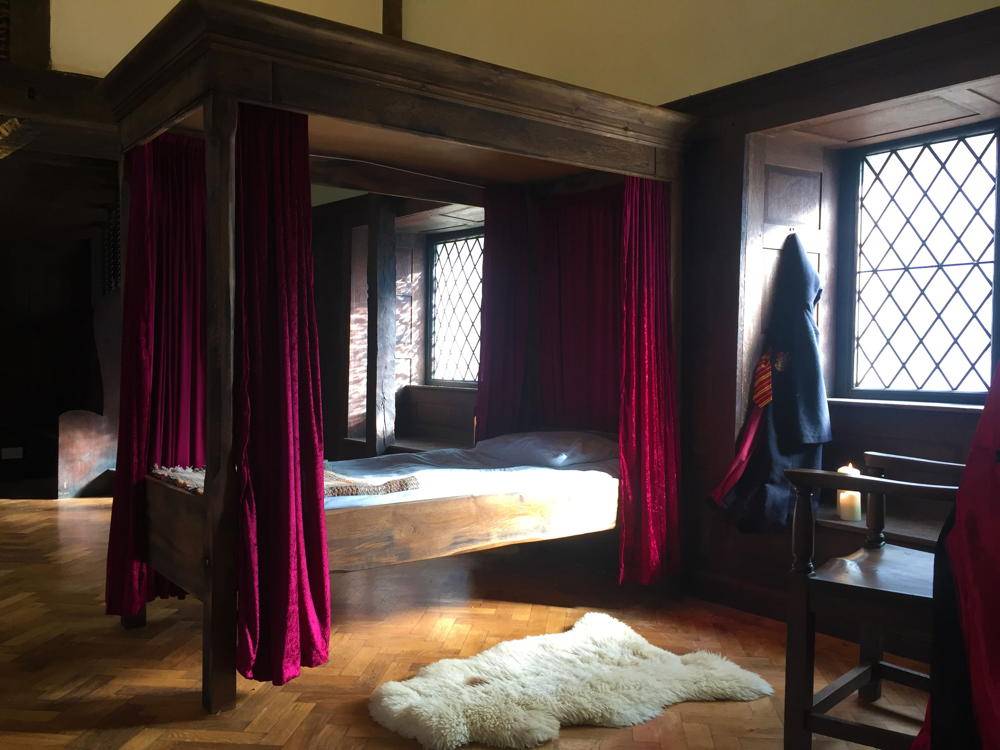 Handmade Harry Potter four poster bed in wizard-themed bedroom — solid oak fantasy bed, Wales