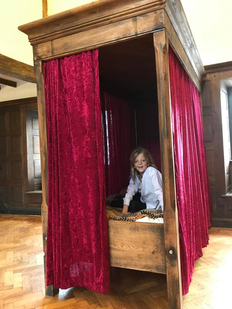 Carved oak Harry Potter four poster bed with magical details — handmade bespoke children's furniture, Wales