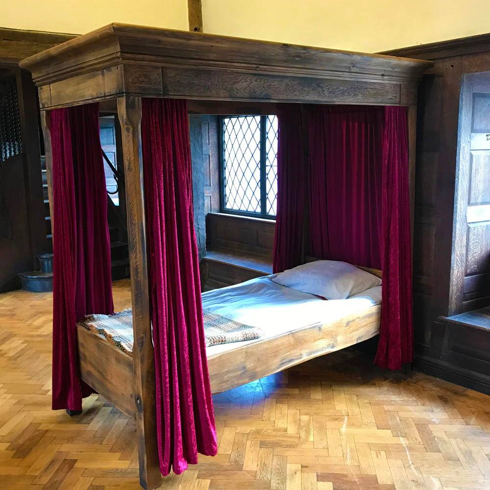 Four Poster Harry Potter Bed crafted from solid oak or pine with a magical design featuring curtains, perfect for themed wizard-inspired bedrooms.