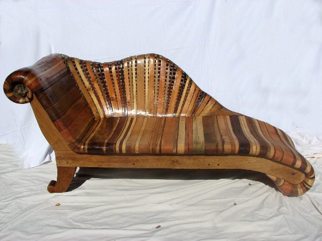 Side view of funky chaise longue — handmade reclaimed wood furniture, Mid Wales