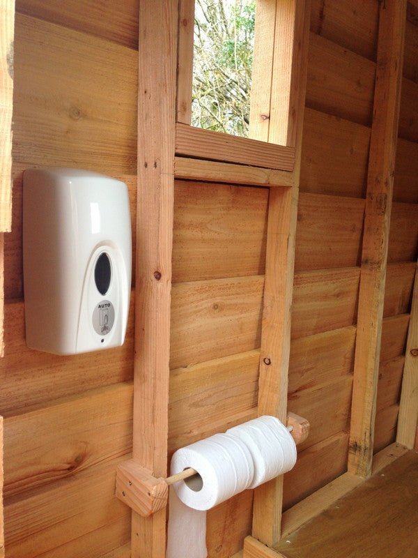 Interior of compost toilet with soap dispenser
