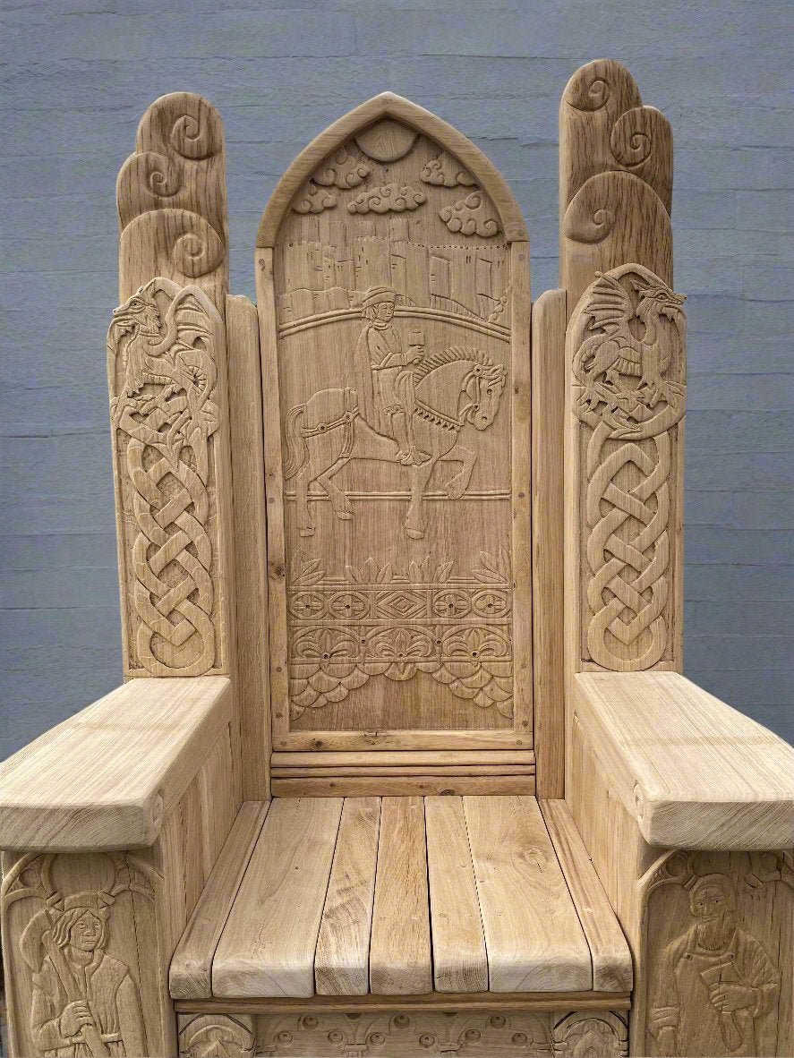 Handcrafted oak throne featuring Celtic carvings, historical figures, and intricate designs, created as part of Conwy Castle’s visitor display in North Wales.