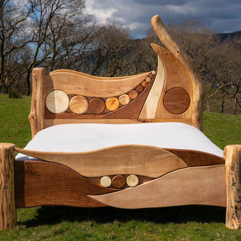 Bespoke Handcrafted Constellations Bed featuring driftwood and hardwood, designed with artistic elements for a unique and eco-friendly sleeping experience.