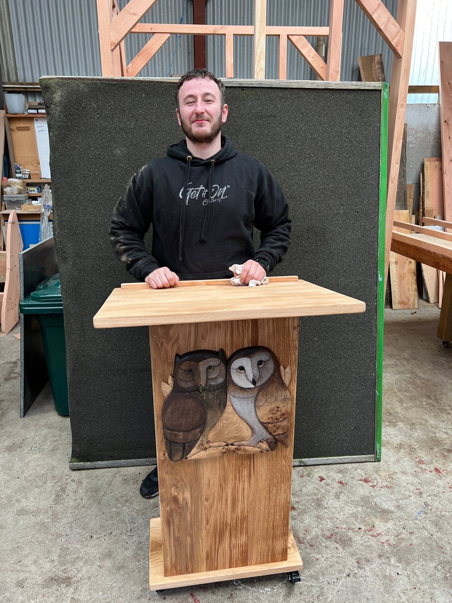 Wooden lectern featuring twin owl carvings, perfect for school assemblies, classrooms, and reading sessions