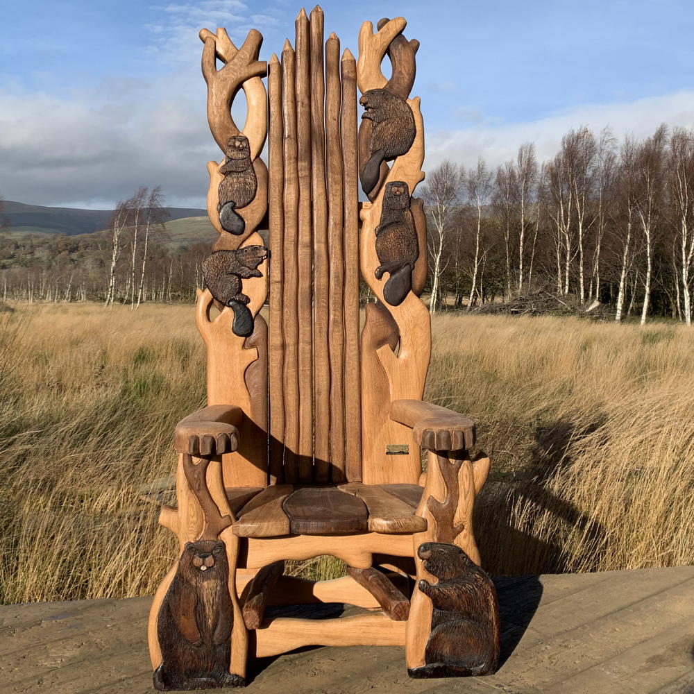 Handcrafted wooden storytelling throne chair with intricate beaver carvings, made from solid oak and designed for outdoor use