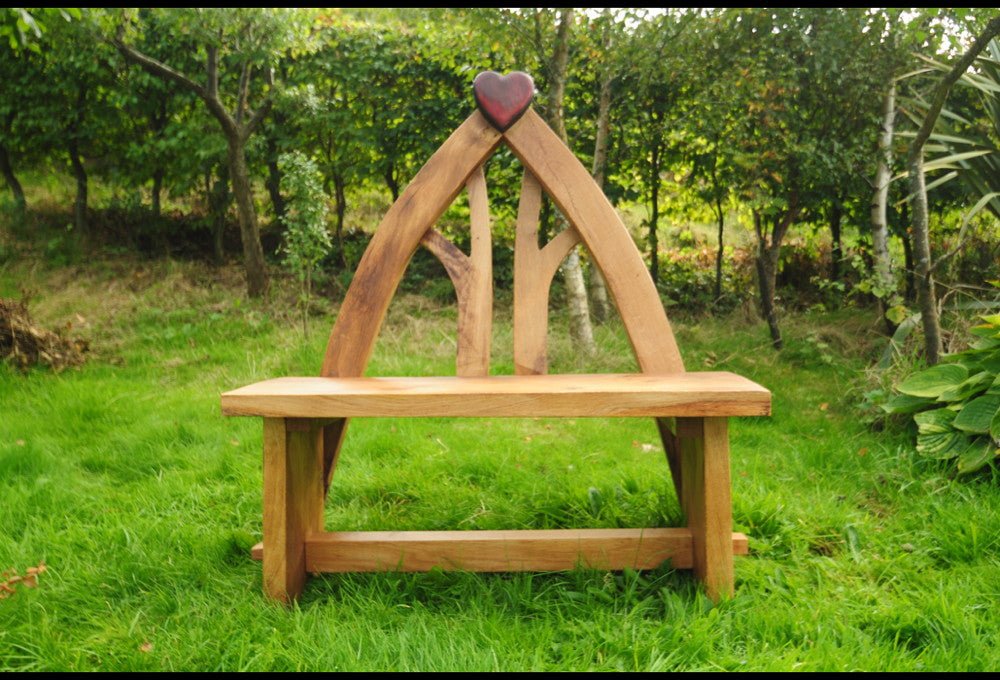 Handmade solid oak wedding bench — carved heart design, bespoke ceremony seating, Wales