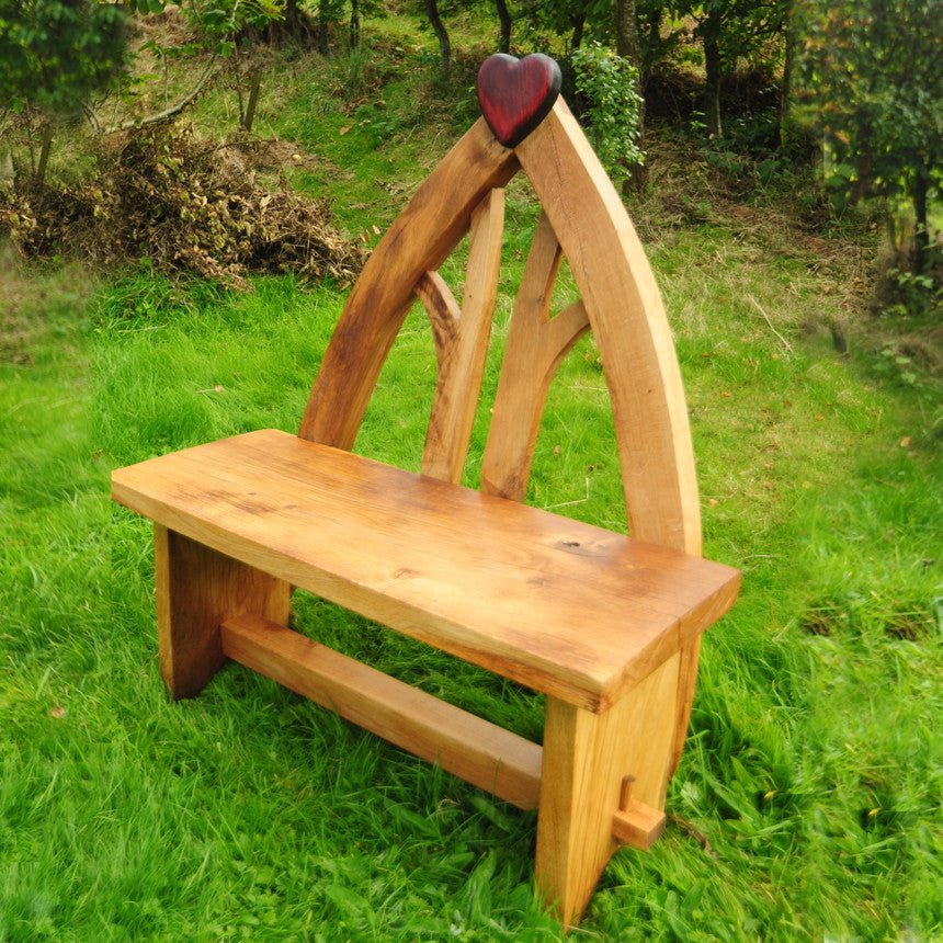 Handmade solid oak heart wooden bench — carved heart motif, bespoke garden seating, Wales