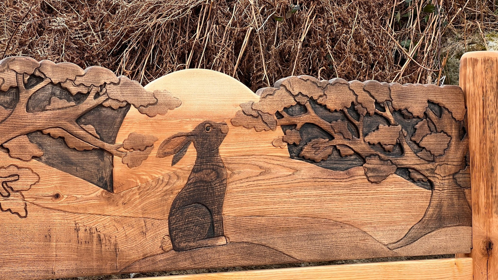 Hand-carved wooden panel with hare and landscape design — bespoke solid oak bed headboard, Wales