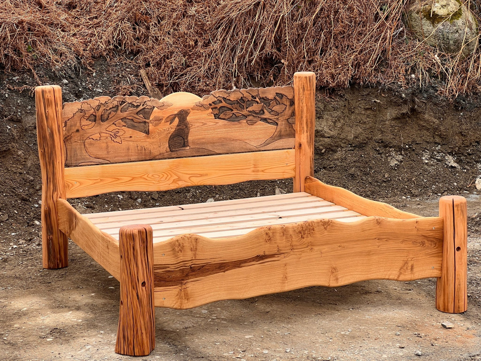 Rustic handmade solid oak bed with carved hare headboard — bespoke, Wales