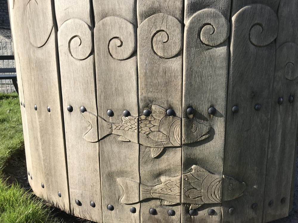 Carved handmade oak bench — Harlech Castle-inspired circular design, Wales