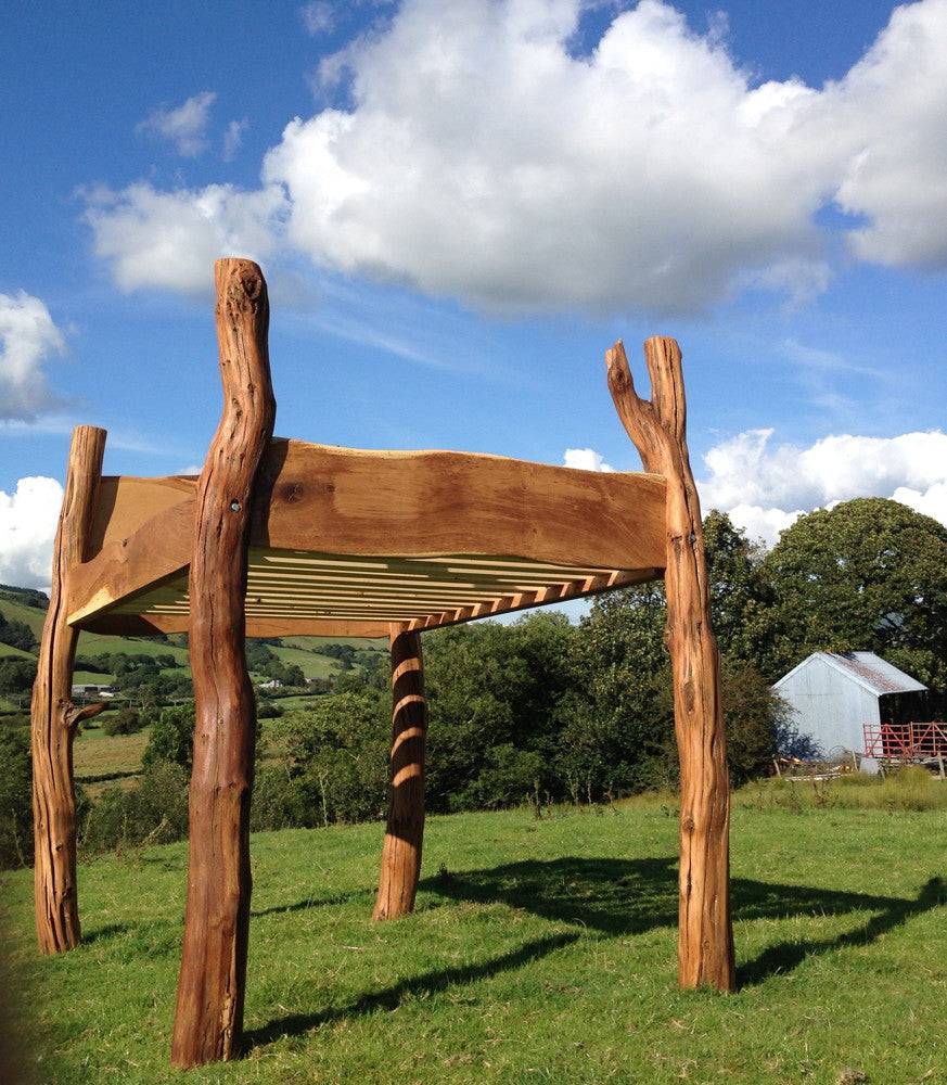 Handmade solid oak outdoor high storage bed — bespoke garden furniture, Wales