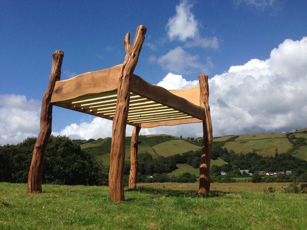 Handmade solid oak outdoor high storage bed in garden — bespoke, Wales