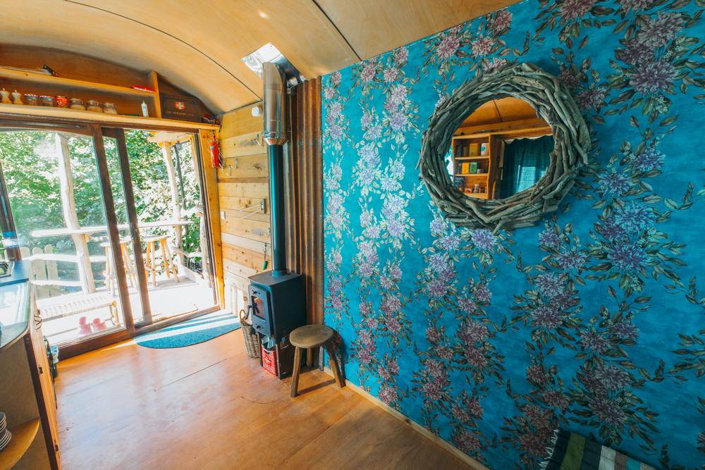 Interior view with floral wall and wood stove