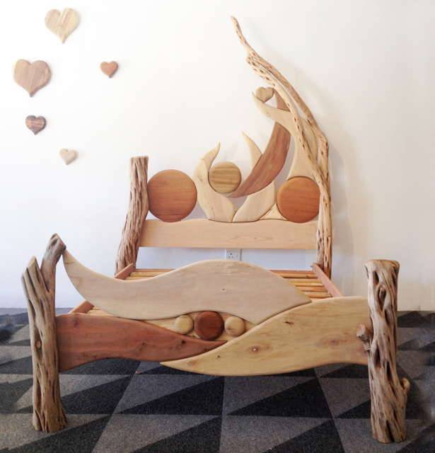 Artistic driftwood bed frame in showroom