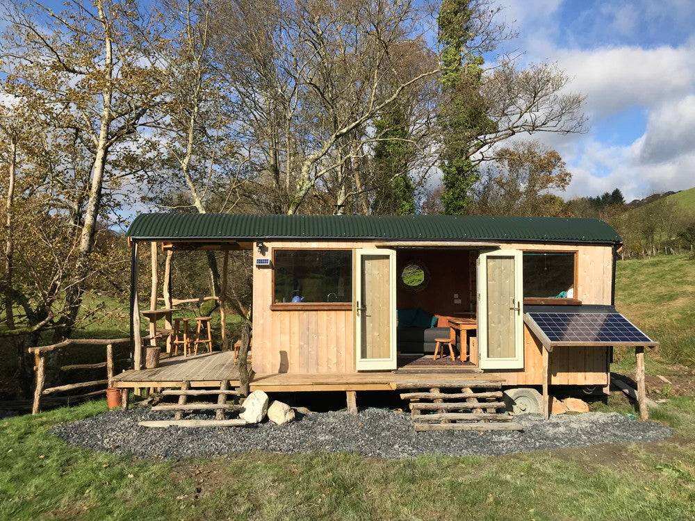 Wooden Shepherd's Hut with solar panel and porch