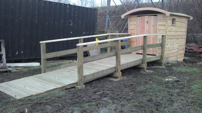 Compost toilet with ramp in muddy area