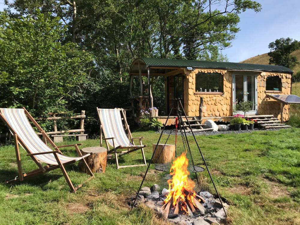 Outdoor seating and fire pit near Shepherd's Hut