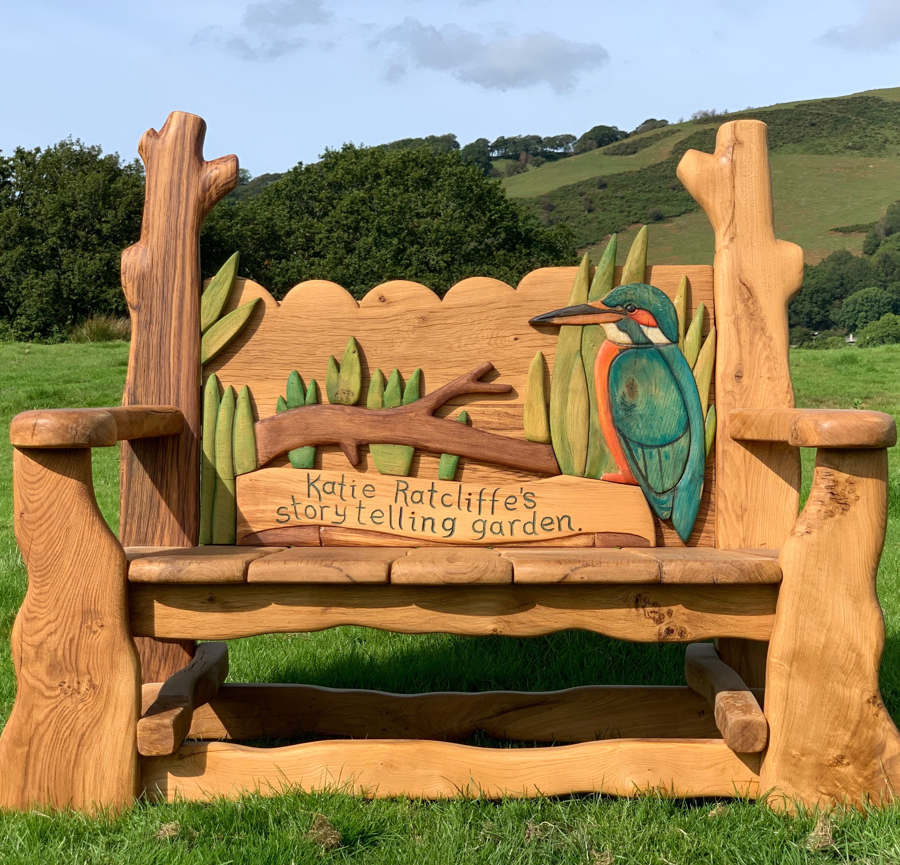 Solid oak bench featuring kingfisher and storytelling theme