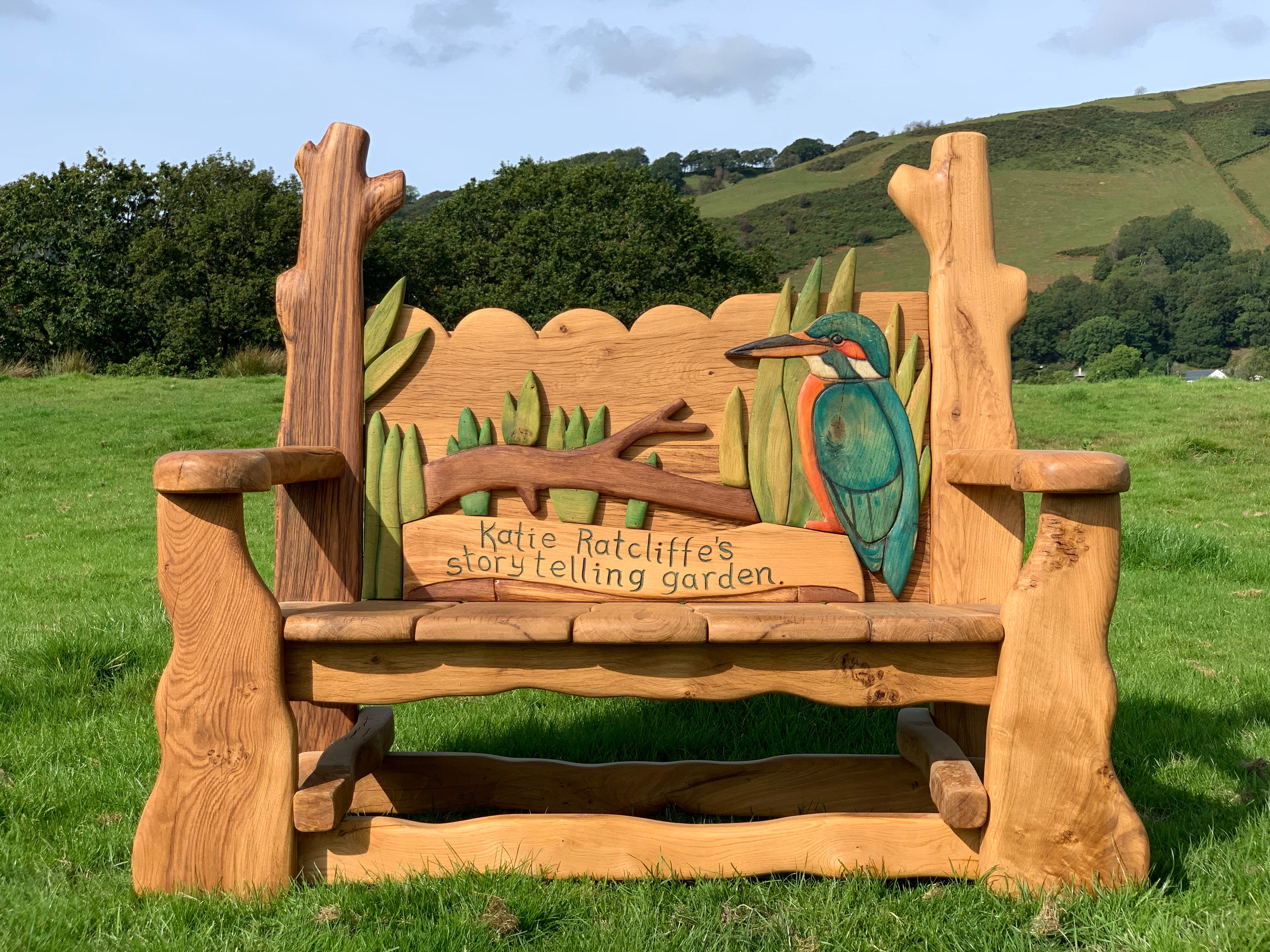 Solid oak bench featuring kingfisher and storytelling theme