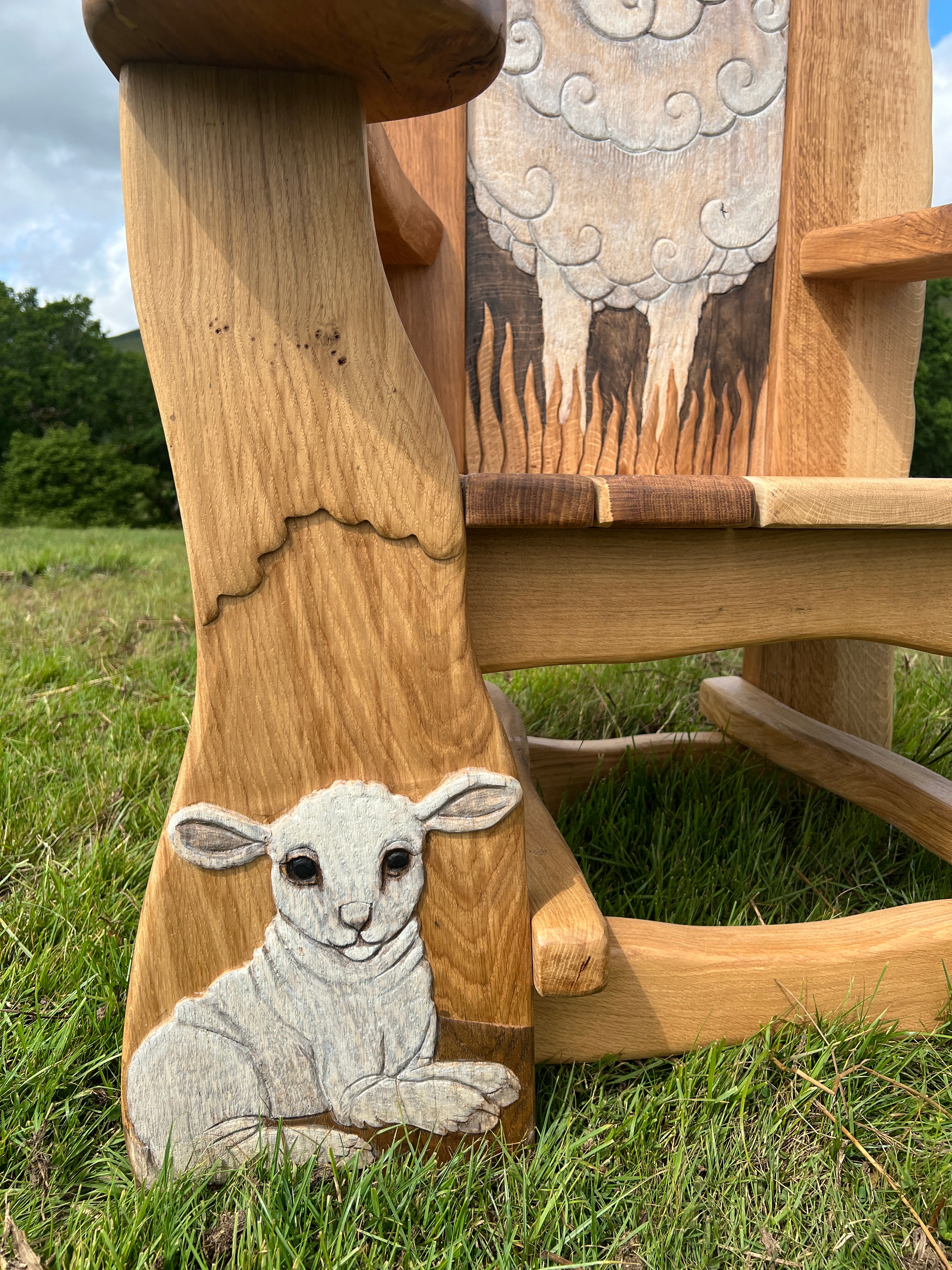 closeup of lamb carved on chair leg