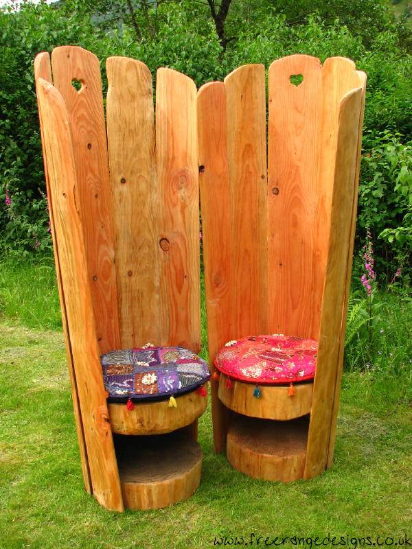 Love chair story time seat in school garden — carved oak, handmade in Wales