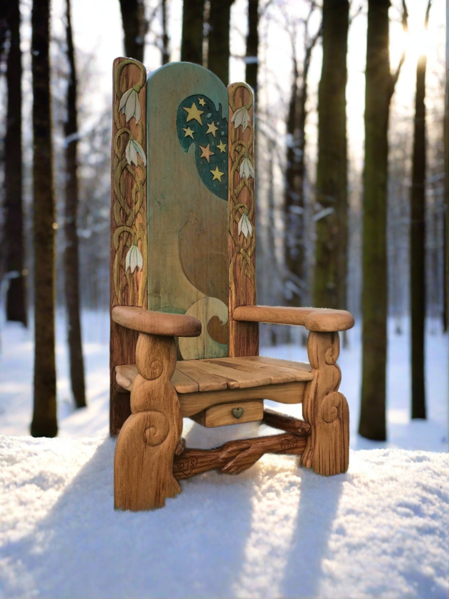 Rustic handmade storytelling chair in winter woods — carved oak, Wales